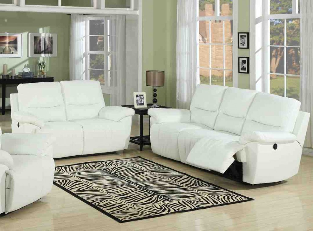 white living room dicor with black leather sofa